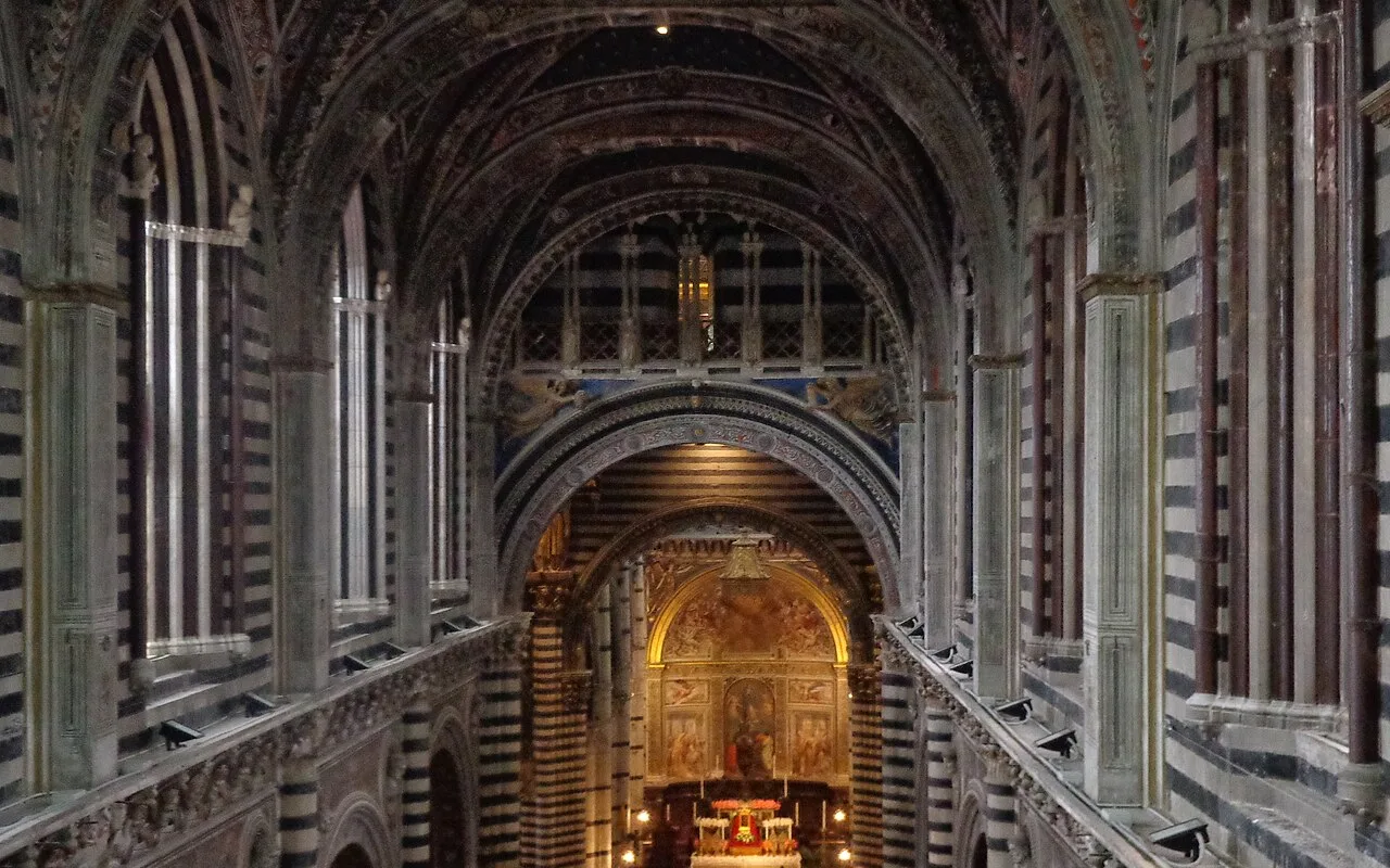 The striped nave of Siena Cathedral from a high gallery